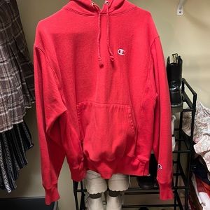 Red reverse weave champion hoodie.
